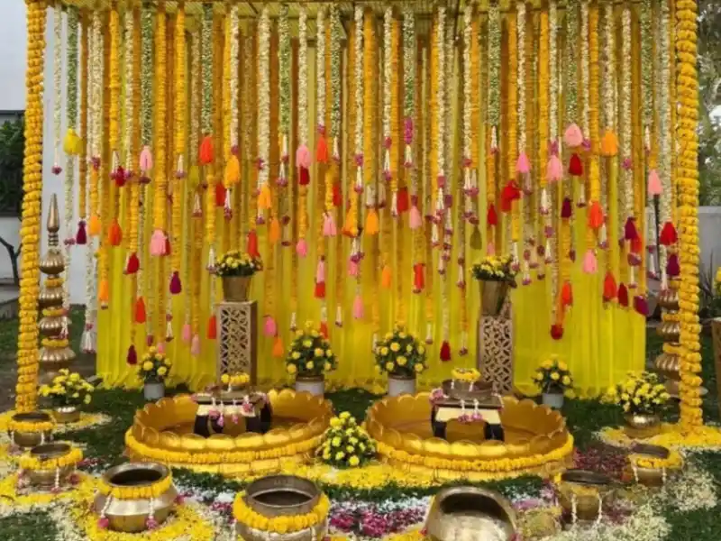 Colourful haldi mehndi decoration setup at home in Kolkata